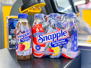 snapple sitting on a checkout belt at walmart