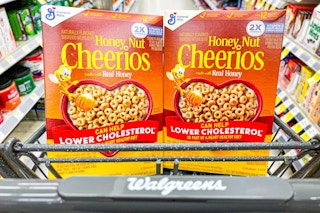 two boxes of honey nut cheerios cereal in walgreens shopping cart