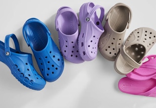 blue, purple, and beige Crocs clogs
