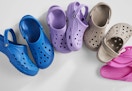 blue, purple, and beige Crocs clogs