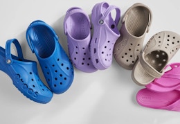 blue, purple, and beige Crocs clogs