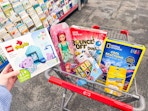 toys in a cart including lego duplo, barbie, national geographic, bounce-off and more