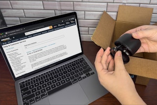 Someone looking at some earbuds ordered from Amazon third party seller, and one of the buds is missing next to a laptop displaying the ...