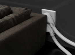 extension cords plugged into a wall