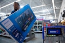 a woman shopping tvs at walmart 