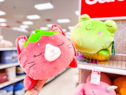 hand holding squishmallows jumbo plush at target