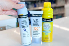 hand grabbing neutrogena sunscreen