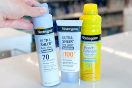 hand grabbing neutrogena sunscreen