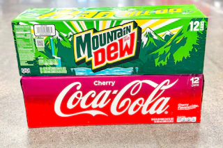 cherry coke and mountain dew stacked on floor