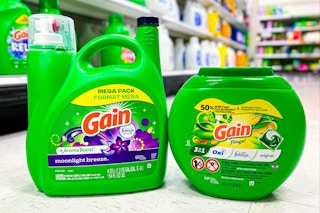 gain laundry detergent and flings sitting on floor