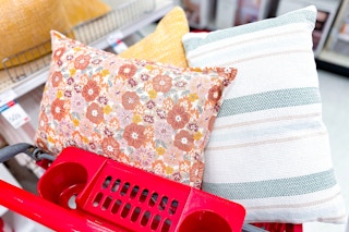 room essentials throw pillows sitting in a target cart