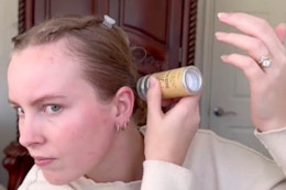 a woman using a wax stick