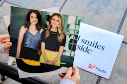 person holding walgreens 8x10 photo print with heather and joanie