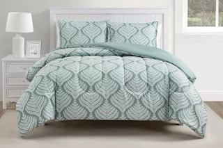 A printed comforter set on a bed