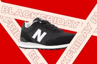 A black new balance shoe behind pink tape