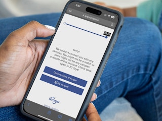Someone holding a phone showing a message from the Kroger Sample Box survey saying they couldn't match the user to any samples, or that ...