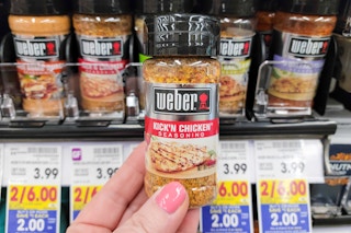 hand holding a bottle of weber seasoning at kroger 