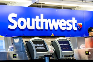 southwest airlines airport check-in counter with employees