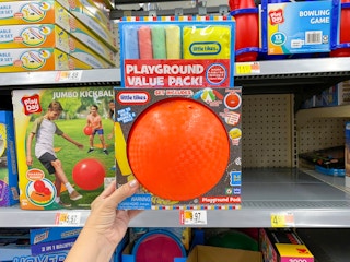 hand holding little tikes playground value pack at walmart