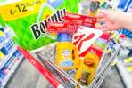 bounty paper towels, colgate toothpaste, special k cereal, arm & hammer detergent, and garnier shampoo in a cart