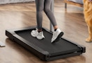 person walking on a walking pad