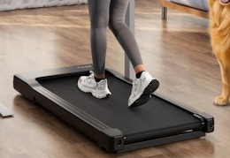 person walking on a walking pad