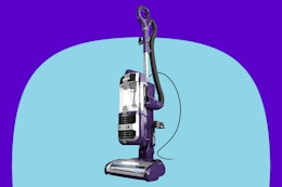 Shark Lift-Away Upright Vacuum on a blue background.