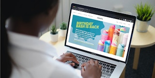 Someone looking at the Owala Birthday Bash webpage on a laptop