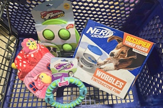 a variety of dog toys in a cart