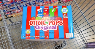 A box of Otter Pops in a shopping cart