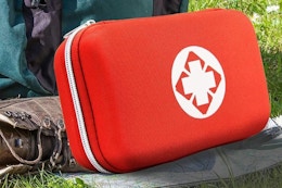 a first aid kit on the grass