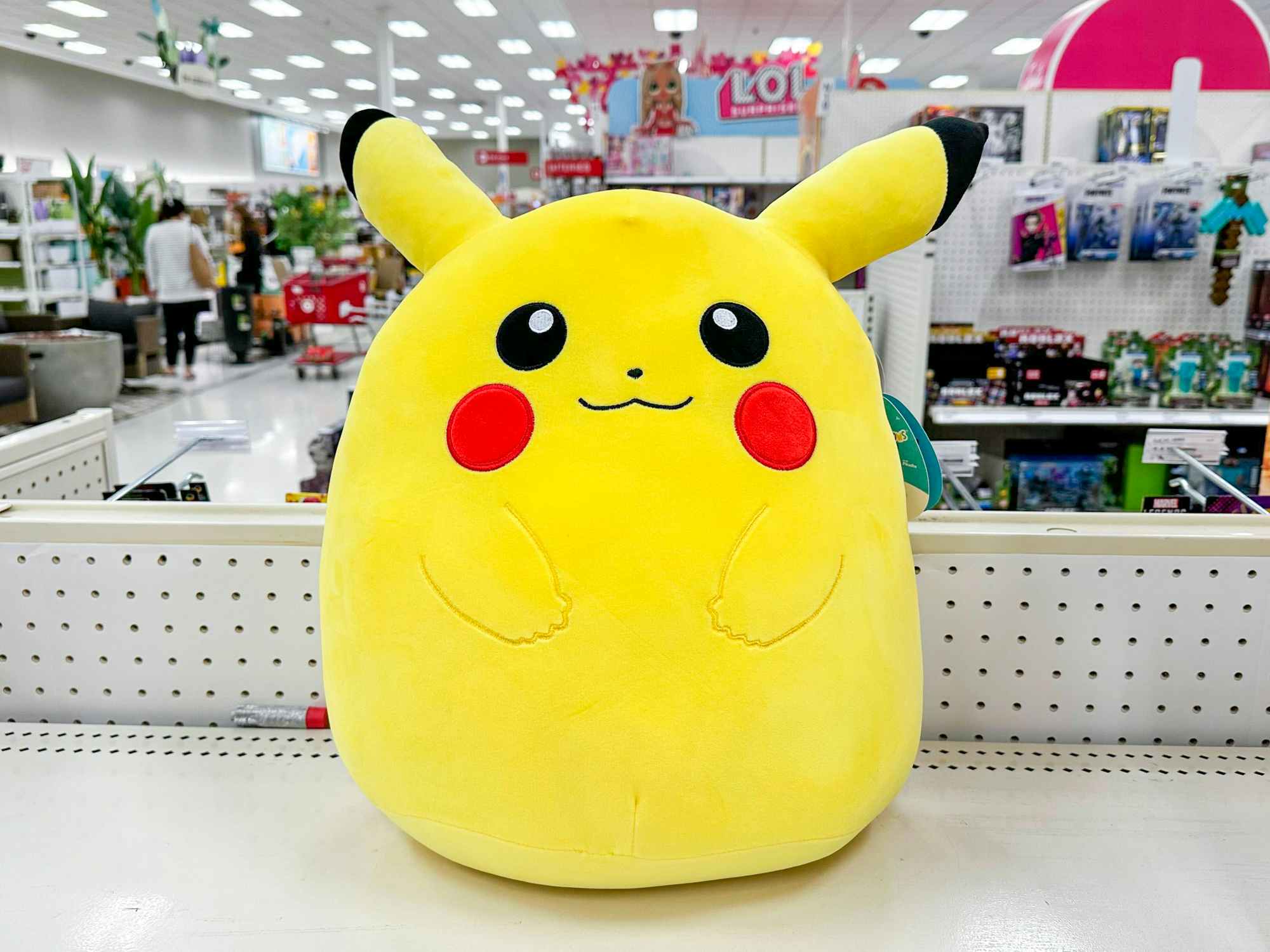 A Pikachu Pokemon Squishmallow on a shelf at Target