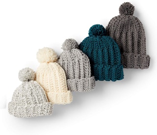 A row of knit beanies.