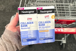 hand holding two boxes of neutrogena collagen bank moisturizer