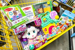 yellow shopping cart filled with toys