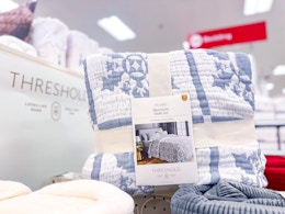 threshold quilt set sitting on a target display