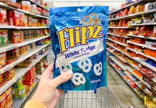 flipz fudge covered pretzels held up in center of aisle