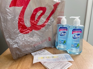 dial hand soap with Walgreens bag and receipt on table
