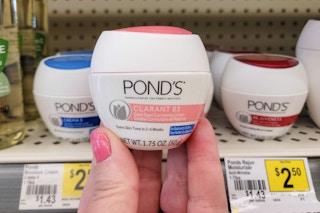hand holding a jar of ponds cream at dollar general