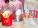 close up for girl dipping fries in ice cream