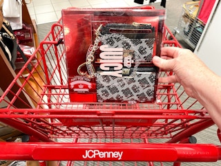 someone holding a juicy couture boxed gift set