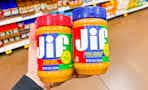 hand holding jars of jif peanut butter