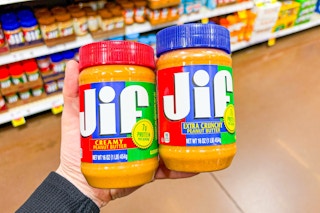 hand holding jars of jif peanut butter