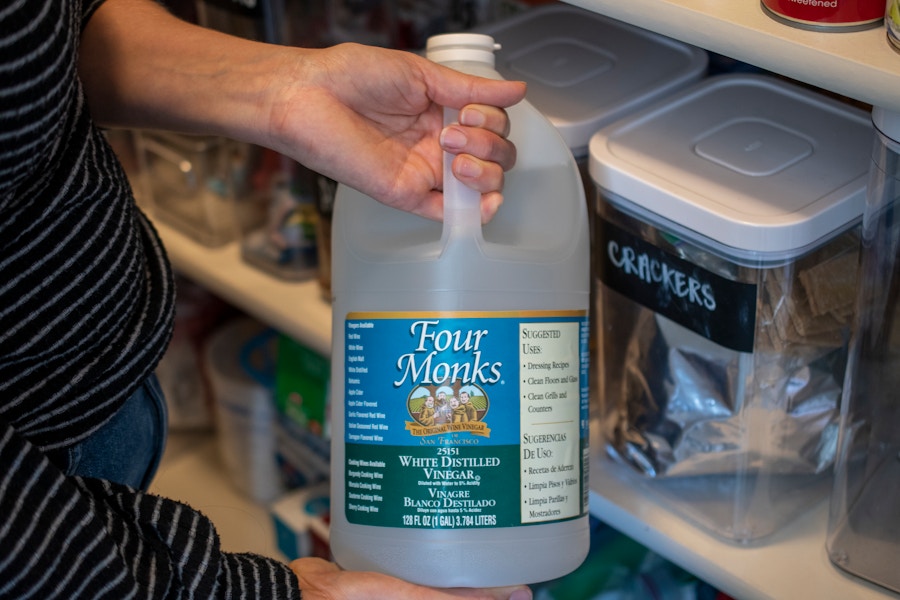 A bottle of white vinegar in a pantry