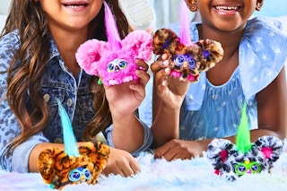 Lifestyle image of two girls playing with the Furby Furblet 4-pack 