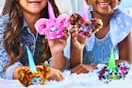 Lifestyle image of two girls playing with the Furby Furblet 4-pack