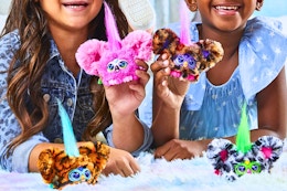 Lifestyle image of two girls playing with the Furby Furblet 4-pack