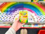 hand holding a pack of crayola crayons in staples