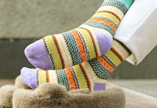 a set of colorful socks being worn