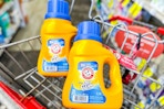 2 arm and hammer laundry detergents in a cart
